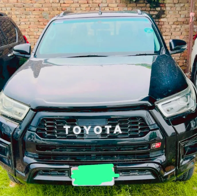 Black Toyota Hilux Revo pickup available for rent